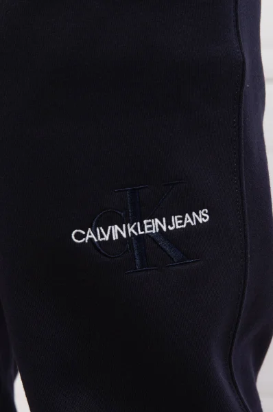 Spodnie dresowe OFF PLACED ICONIC | Regular Fit CALVIN KLEIN JEANS granatowy